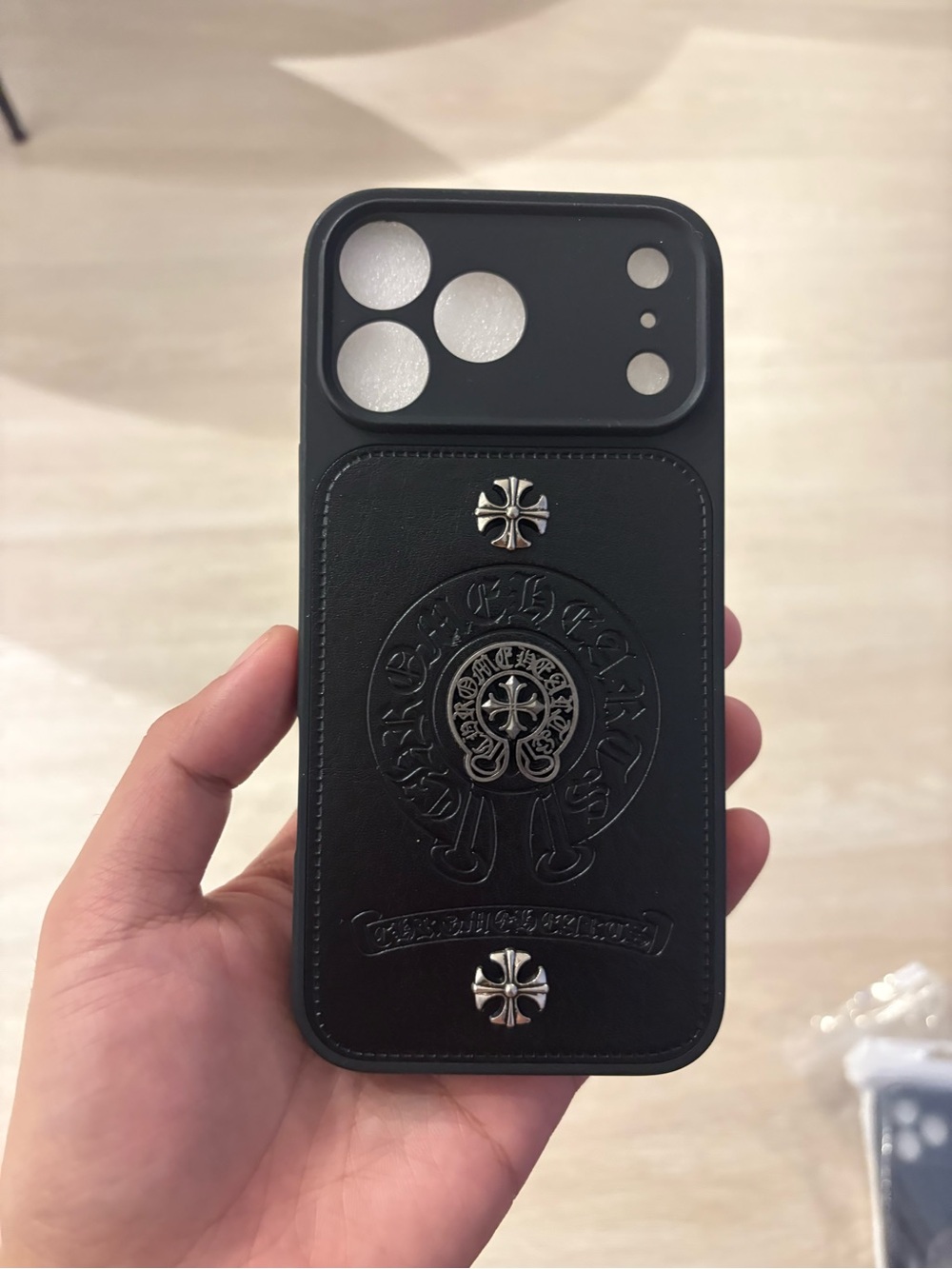 Black Leather-Style Phone Case with Embossed Crest and Silver Cross Studs